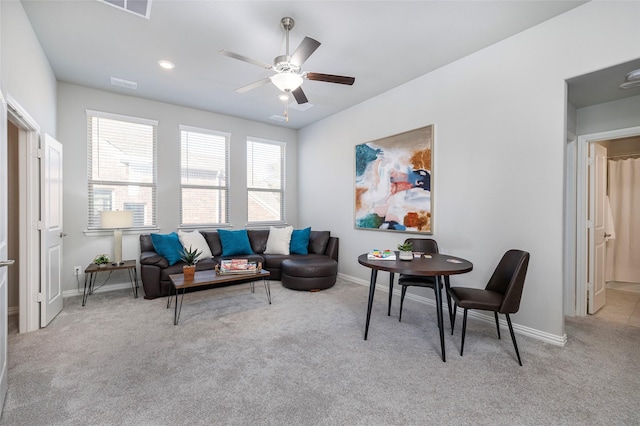 living area featuring ceiling fan, recessed lighting, light carpet, visible vents, and baseboards