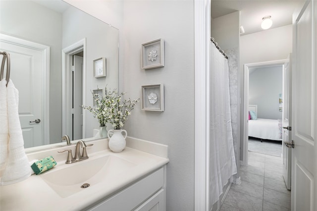 bathroom with tile patterned flooring and vanity