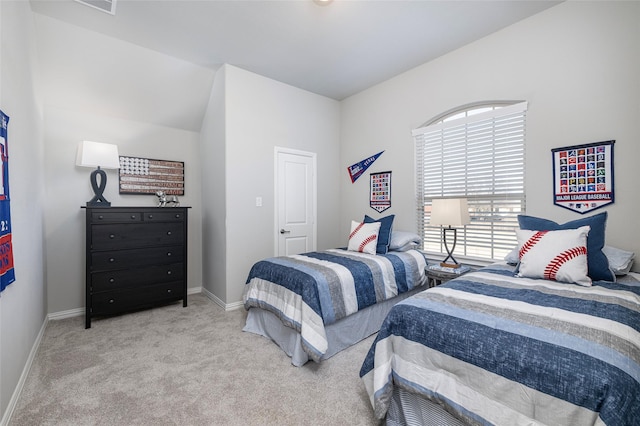 carpeted bedroom featuring baseboards