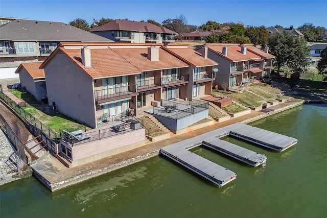 aerial view with a water view and a residential view