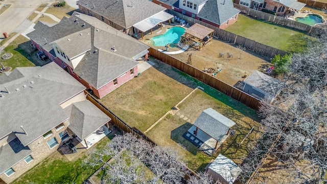 birds eye view of property with a residential view