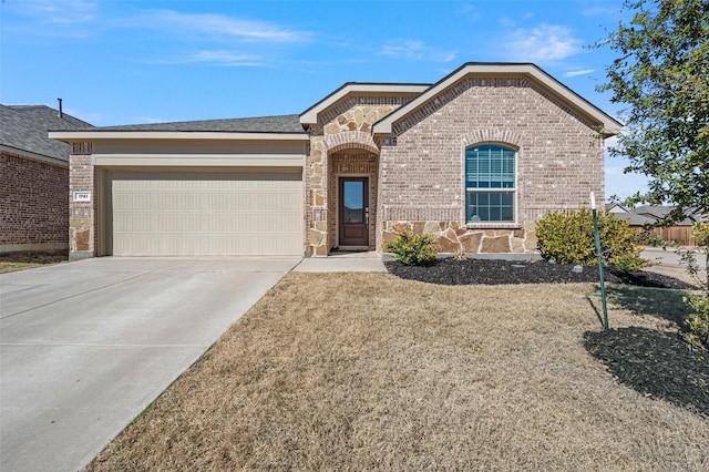 view of front facade featuring a garage, concrete driveway, and brick siding