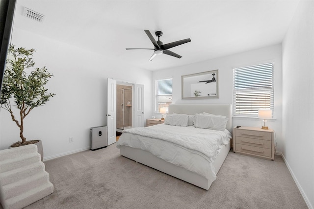 bedroom with light carpet, baseboards, multiple windows, and visible vents