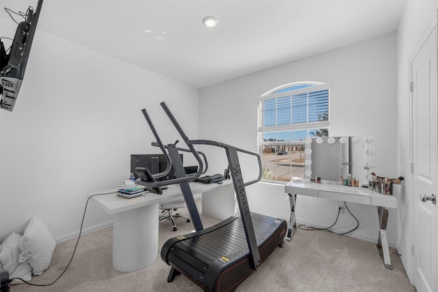 workout room with carpet flooring and baseboards