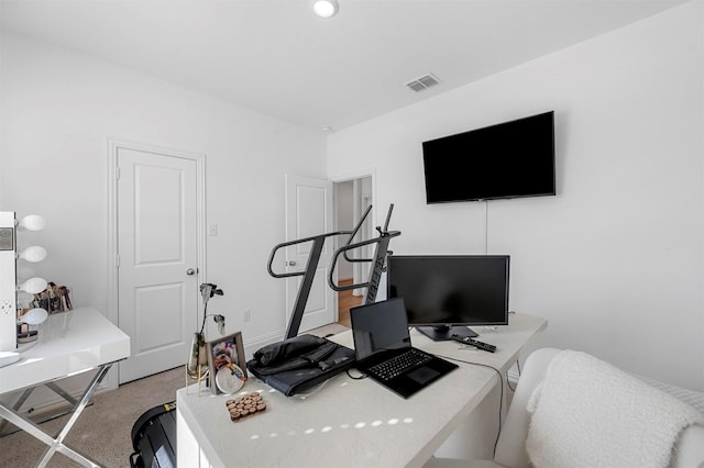 home office featuring visible vents and carpet flooring