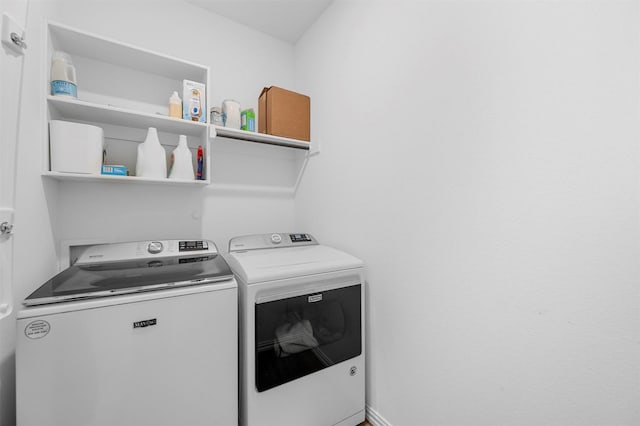 washroom with laundry area and washing machine and clothes dryer