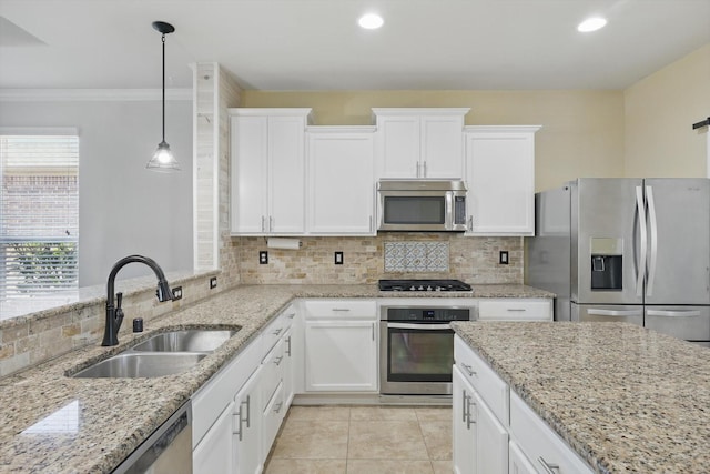 kitchen featuring stainless steel appliances, backsplash, white cabinetry, a sink, and light tile patterned flooring