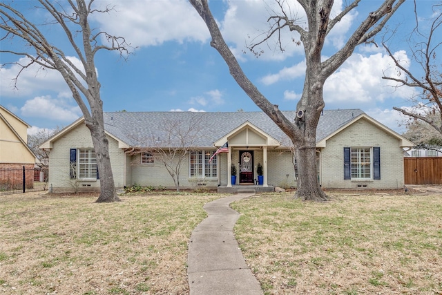 single story home featuring crawl space, a front yard, fence, and brick siding