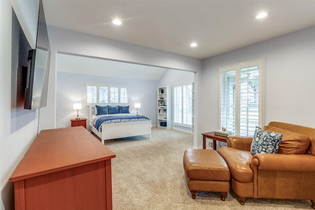 bedroom featuring light carpet, multiple windows, vaulted ceiling, and recessed lighting