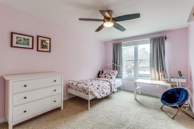 bedroom featuring baseboards, ceiling fan, and light colored carpet