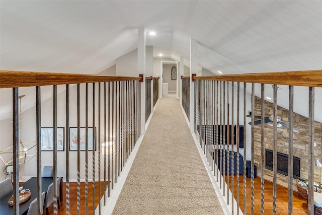 hallway featuring recessed lighting and vaulted ceiling