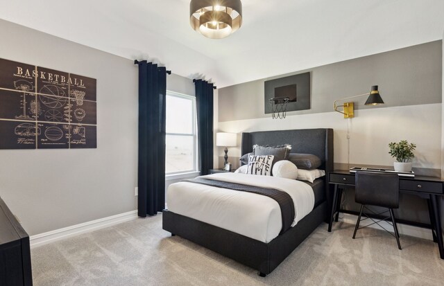 bedroom featuring carpet floors, baseboards, and lofted ceiling