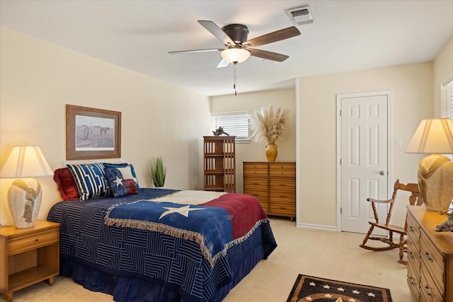 bedroom featuring light carpet, baseboards, visible vents, and a ceiling fan