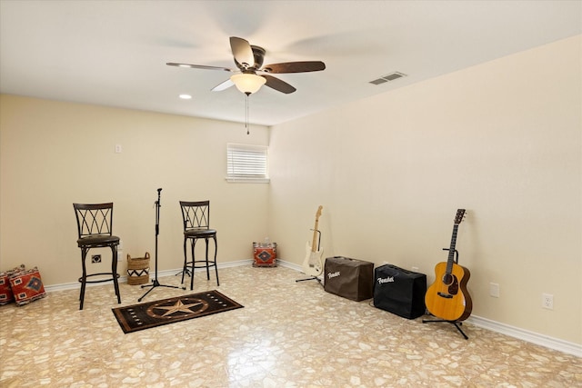 interior space featuring ceiling fan, visible vents, and baseboards