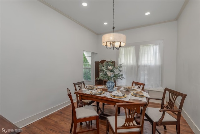 dining area with recessed lighting, an inviting chandelier, ornamental molding, wood finished floors, and baseboards