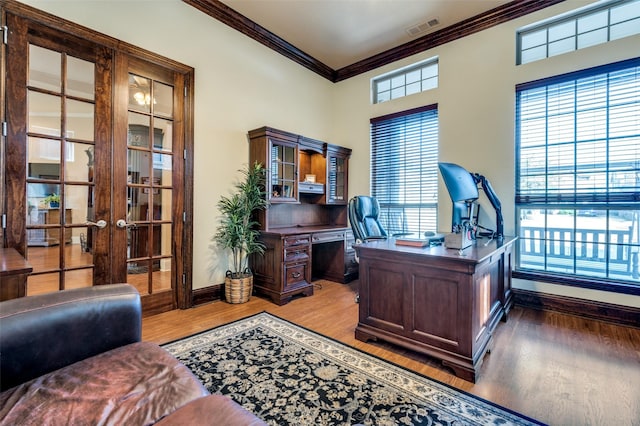2807 Millington Dr, Highland Village, TX 75077 - office area with a healthy amount of sunlight, visible vents, crown molding, and wood finished floors