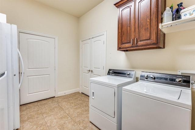 2807 Millington Dr, Highland Village, TX 75077 - laundry room featuring light tile patterned flooring, washing machine and dryer, cabinet space, and baseboards