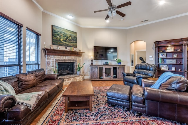 2807 Millington Dr, Highland Village, TX 75077 - living room with arched walkways, visible vents, crown molding, and wood finished floors