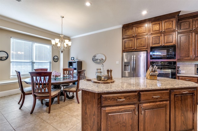 2807 Millington Dr, Highland Village, TX 75077 - kitchen with a chandelier, light tile patterned flooring, hanging light fixtures, ornamental molding, and black appliances