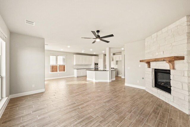 carpeted bedroom with ceiling fan, baseboards, visible vents, and vaulted ceiling