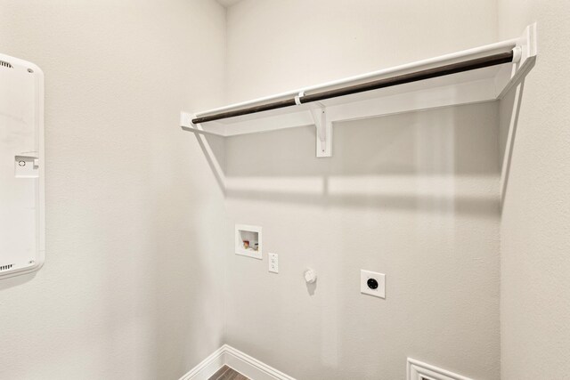 dining room featuring a healthy amount of sunlight, baseboards, visible vents, and wood finished floors