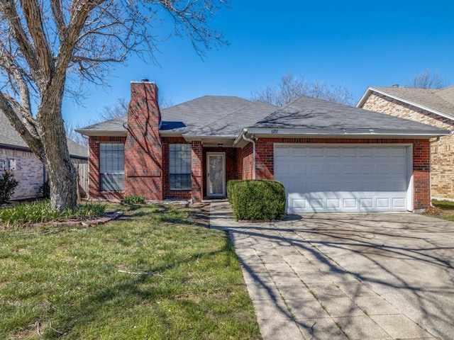 ranch-style home featuring driveway, brick siding, a chimney, an attached garage, and a front yard