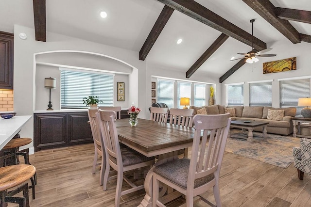 dining room with beam ceiling, light wood-style flooring, and recessed lighting