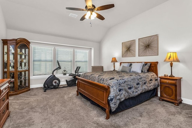 carpeted bedroom featuring visible vents, baseboards, ceiling fan, and vaulted ceiling