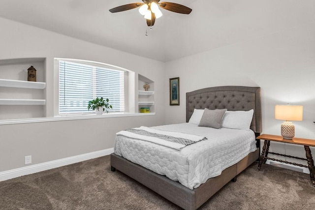 carpeted bedroom featuring baseboards and a ceiling fan