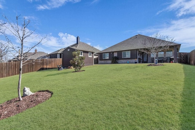 view of yard featuring a fenced backyard