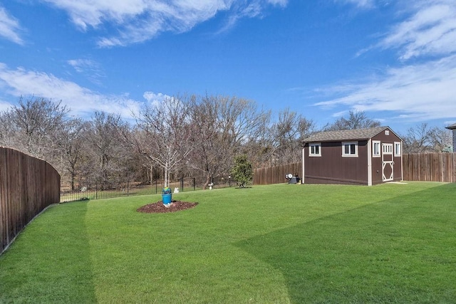 view of yard with a storage unit, an outdoor structure, and a fenced backyard