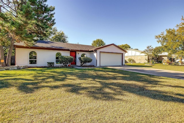 view of front facade with a garage, stucco siding, concrete driveway, and a front yard