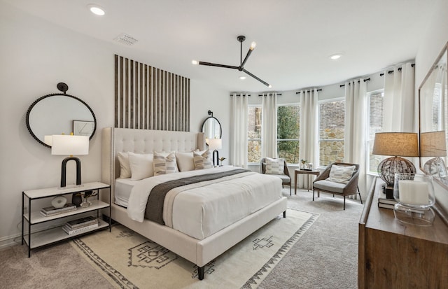 bedroom featuring recessed lighting, light colored carpet, and visible vents