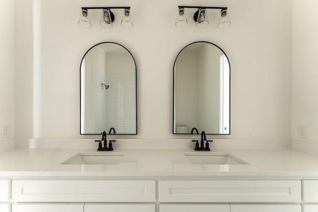 bathroom with double vanity and a sink