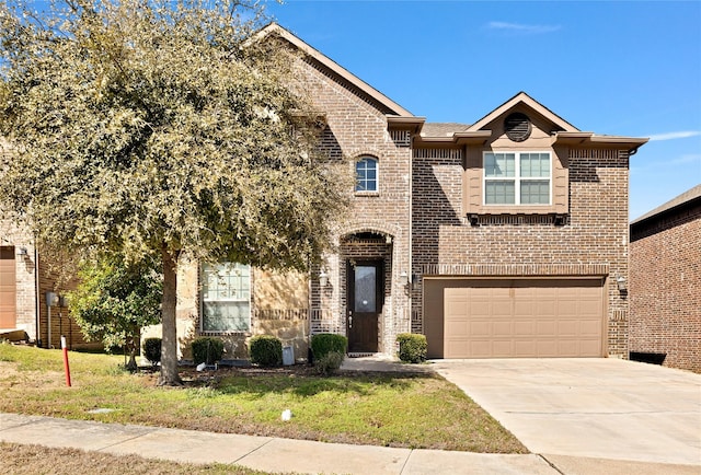 view of front of property with a garage, concrete driveway, and brick siding