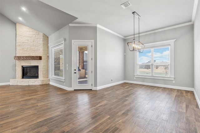 interior space with a chandelier, a fireplace, visible vents, baseboards, and dark wood-style floors