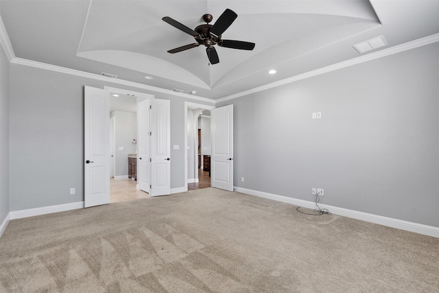 unfurnished bedroom with ornamental molding, light carpet, and visible vents