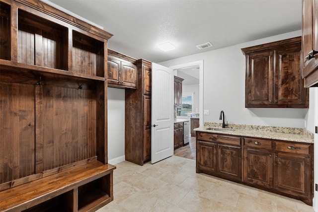 mudroom with visible vents and a sink