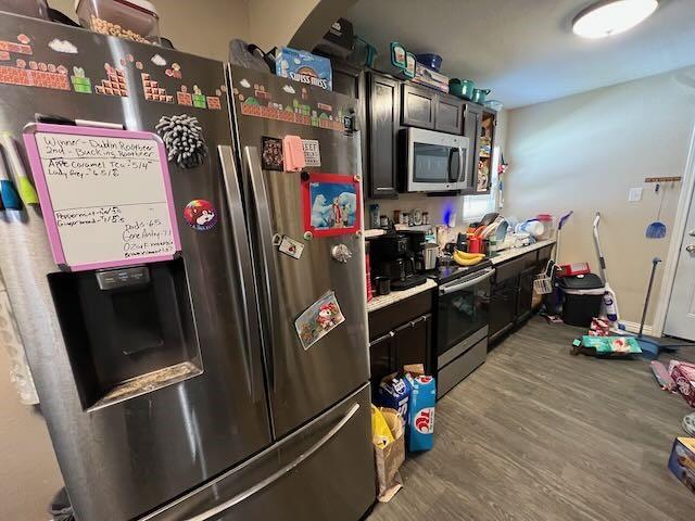 kitchen with stainless steel appliances and wood finished floors