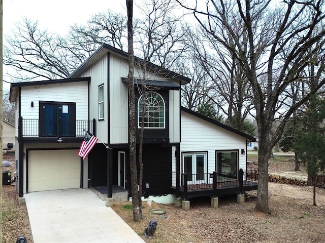 view of front of house featuring a garage and concrete driveway