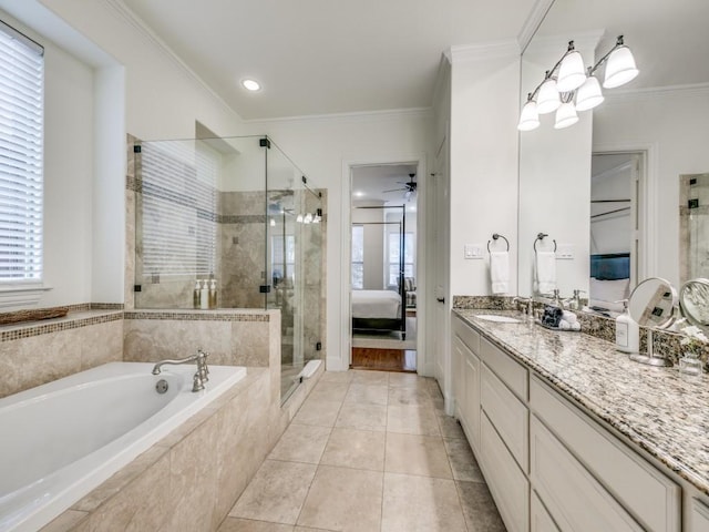 ensuite bathroom with a garden tub, ornamental molding, a shower stall, vanity, and ensuite bath