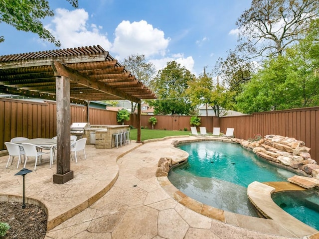 view of pool with an outdoor kitchen, a fenced backyard, a grill, a patio area, and a pergola