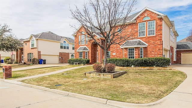 traditional home with brick siding, driveway, and a front lawn