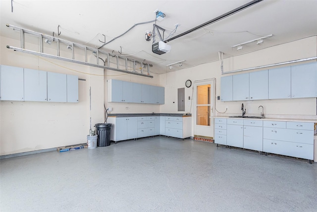 garage featuring electric panel and a garage door opener