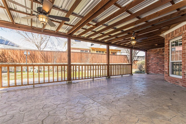 view of patio / terrace featuring ceiling fan and fence