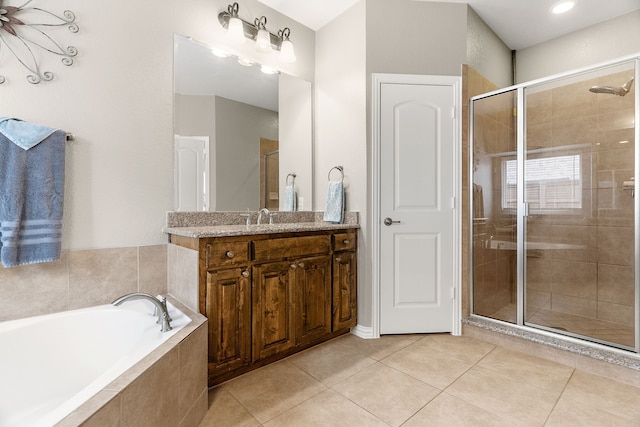 full bathroom featuring a shower stall, vanity, and tile patterned floors