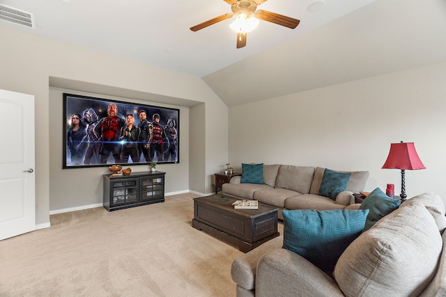 home theater room featuring lofted ceiling, ceiling fan, carpet floors, visible vents, and baseboards