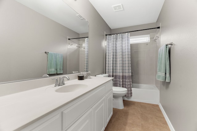 full bathroom with visible vents, toilet, vanity, baseboards, and tile patterned floors