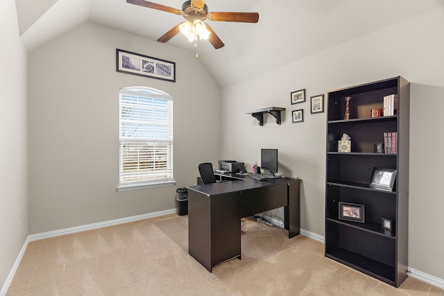 office area featuring lofted ceiling, light colored carpet, and baseboards