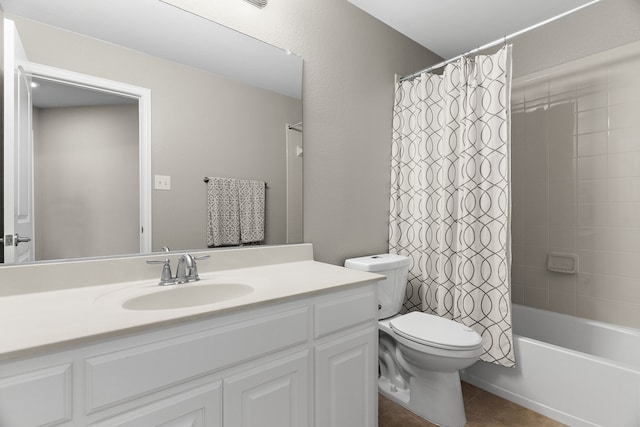 bathroom featuring shower / tub combo, vanity, toilet, and tile patterned floors